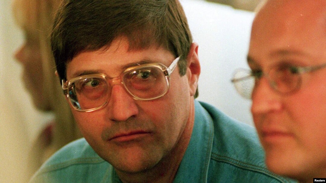 FILE - Leader of an Apartheid-era police and torture squad, Eugene de Kock (L), is seen at a hearing of the Truth and Reconciliation Commission in Pretoria Sept. 14, 1998.