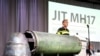 A damaged missile is displayed during a news conference by members of the Joint Investigation Team, who presented interim results in the ongoing investigation of the 2014 MH17 crash in Bunnik, Netherlands, May 24, 2018. 