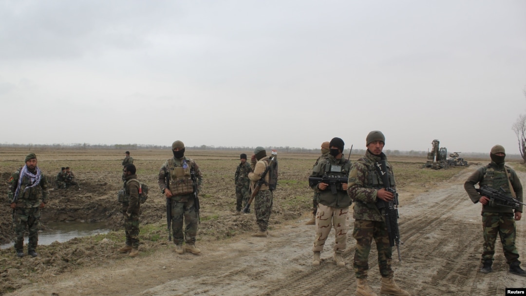 Afghan National Army (ANA) soldiers arrive at the site of last night clashes between Taliban and Afghan forces in Kunduz, Afghanistan, March 4, 2020. 
