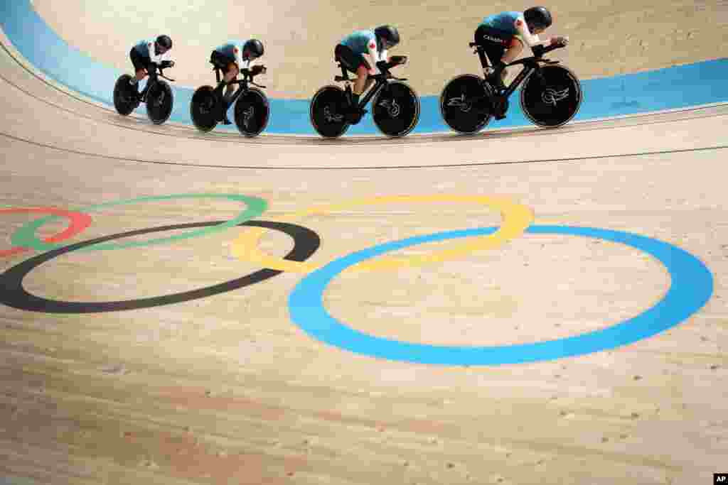Team Canada competes during the track cycling women's team pursuit at the 2020 Summer Olympics in Izu, Japan.