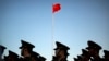 FILE - Chinese paramilitary police stand in formation after a flag raising ceremony at Tiananmen Square on National Day. News of Lei Yang’s death in police custody in May sparked a national outcry, with many voicing concerns online about police brutality and abuse of power. 