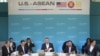President Barack Obama, center, opens up his notebook before delivering remarks at the plenary session meeting of ASEAN, the 10-nation Association of Southeast Asian Nations, at the Annenberg Retreat at Sunnylands in Rancho Mirage, Calif., for Feb. 15, 20