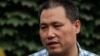 FILE - Chinese human rights lawyer Pu Zhiqiang talks to reporters in Beijing.