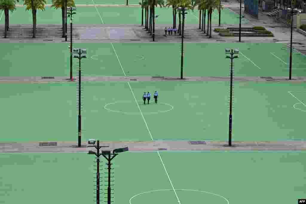 Police patrol at Victoria Park in the Causeway Bay district of Hong Kong, after closing the venue where Hong Kong people traditionally gather annually to mourn the victims of China's Tiananmen Square crackdown in 1989.