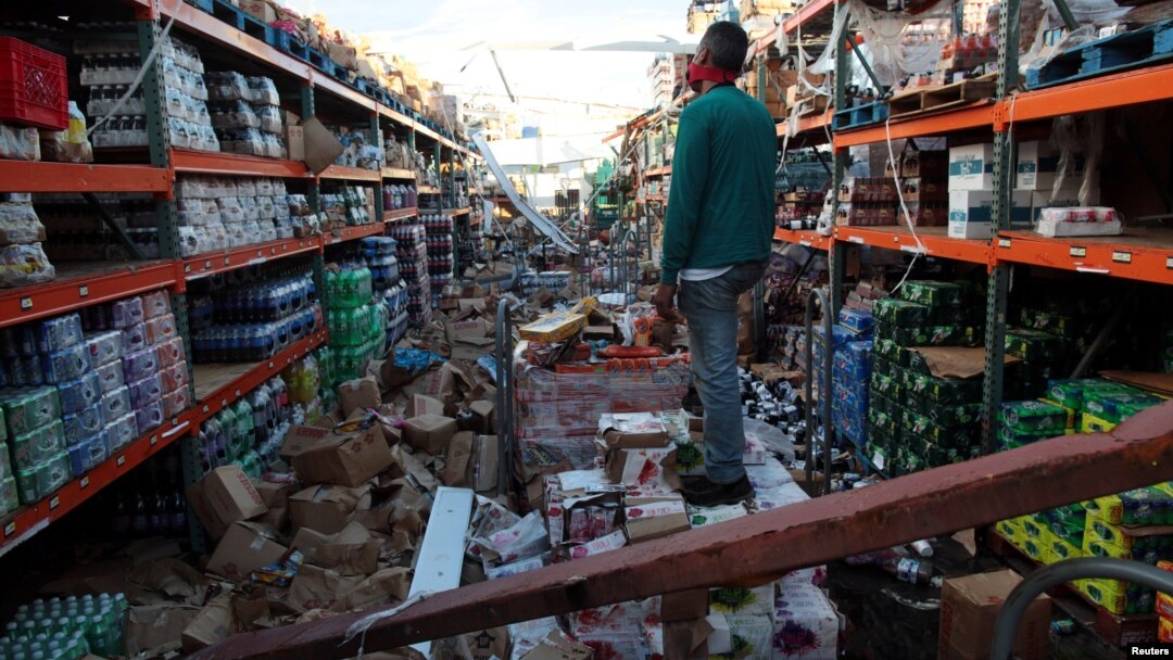 A man stands inside a supermarket destroyed by Hurricane Maria in Salinas, Puerto Rico, Sept. 29, 2017 