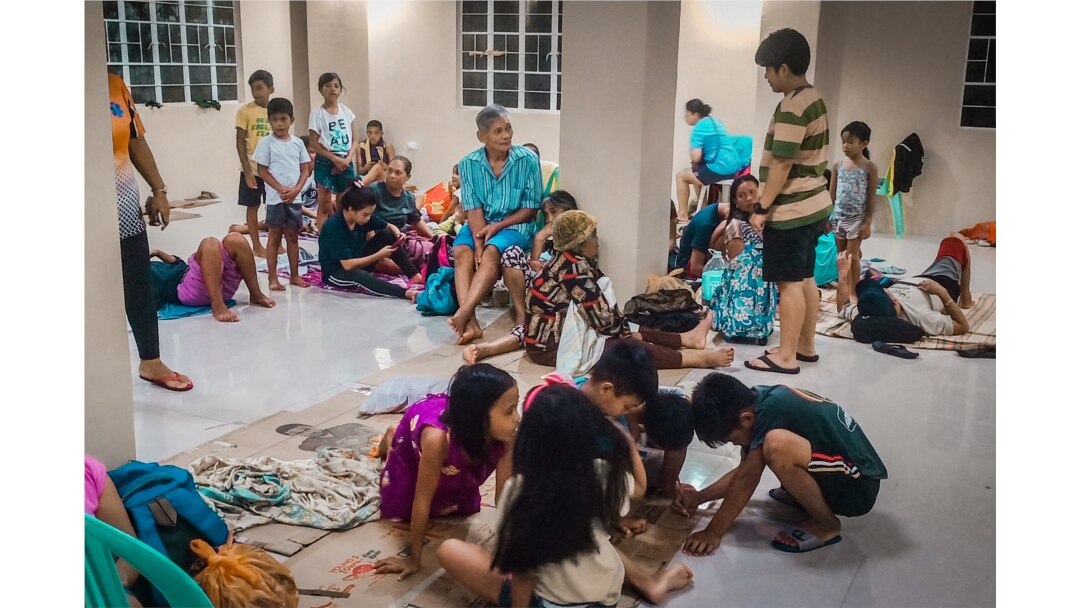 Residents rest in an evacuation center, as Typhoon Phanfone makes landfall, in Borongan, Eastern Samar province, central Philippines, Dec. 24, 2019.