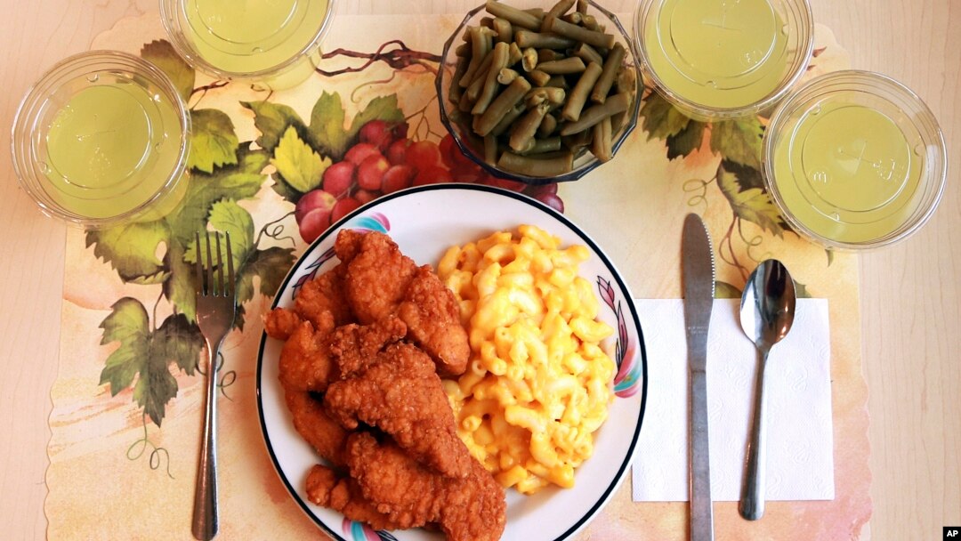 This undated photo provided by the National Institutes of Health in June 2019 shows an "ultra-processed" lunch including brand name macaroni and cheese, chicken tenders, canned green beans and diet lemonade. (Paule Joseph, Shavonne Pocock/NIH via AP)