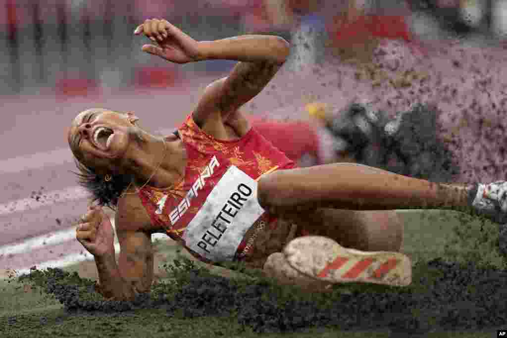 Ana Peleteiro of Spain competes in the final of the women's triple jump at the 2020 Summer Olympics in Tokyo.