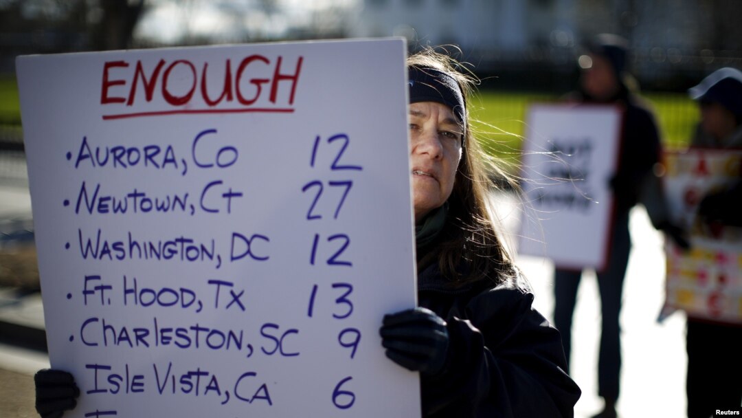 FILE - Gun control activists rally in front of the White House, Washington, Jan. 4, 2016.