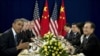 U.S. President Barack Obama (L) speaks as he meets with Chinese Premier Wen Jiabao (R) during the East Asia Summit at the Peace Palace in Phnom Penh, Cambodia, November 20, 2012.