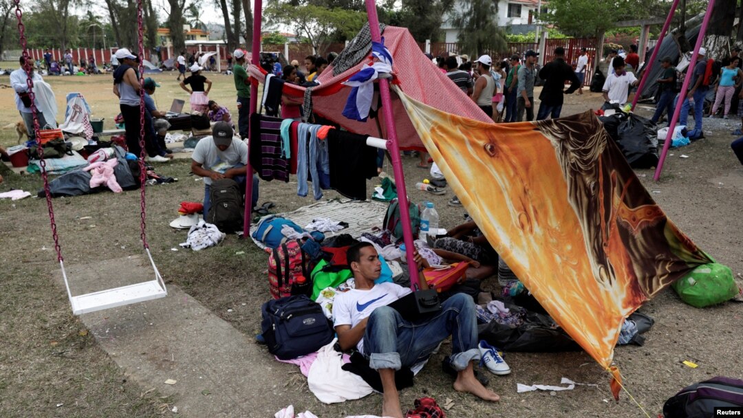Central American migrants take a break from traveling toward the U.S., in Matias Romero, Oaxaca, Mexico, April 3, 2018. 