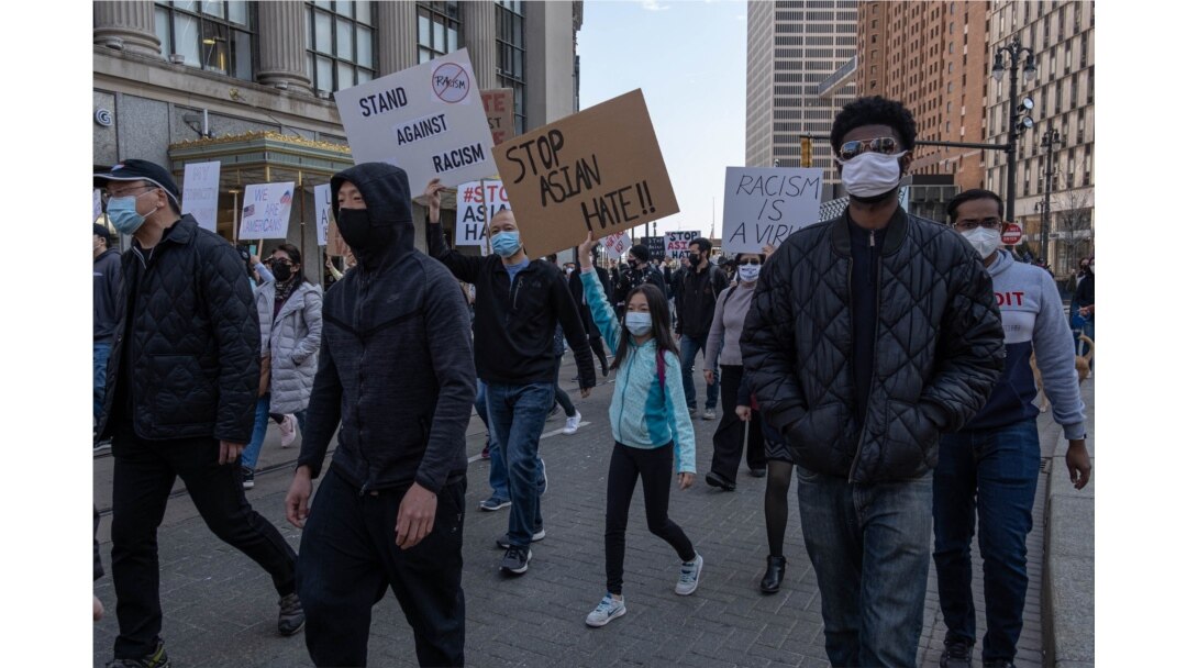 People march during a ‘Stop Asian Hate’ rally in downtown Detroit, Michigan on March 27,2021, as part of a nation wide protest in solidarity against hate crimes directed towards Asian Americans.