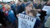 A woman holds a poster that reads: "Elections are when you can choose," as people gathered for a protest in St. Petersburg, Russia, Sept. 5, 2019. 