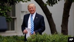 President Donald Trump arrives in the Kennedy Garden of the White House in Washington, May 1, 2017.