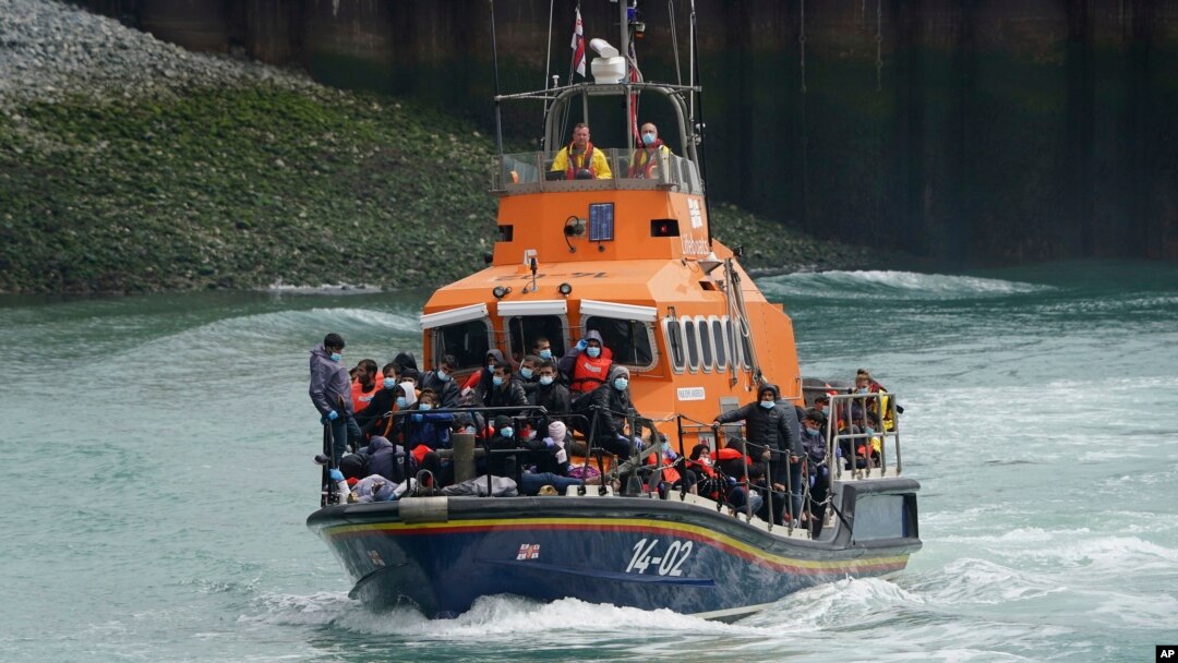 A group of people thought to be migrants are brought in to Dover onboard a lifeboat following a small boat incident in the Channel, in Kent, England, July 4, 2021. 